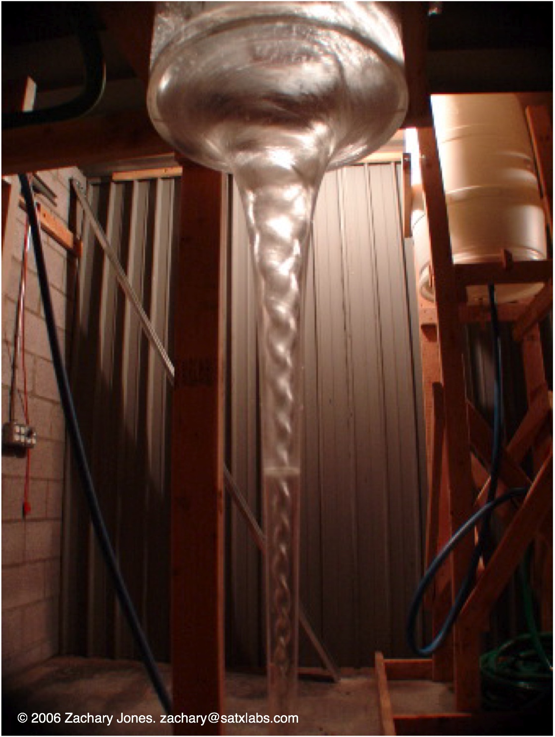 a phi vortex water flow, showing DNA-like spiral braiding